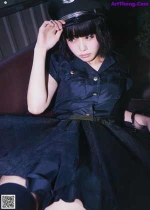 A magazine with a picture of a woman in a school uniform.