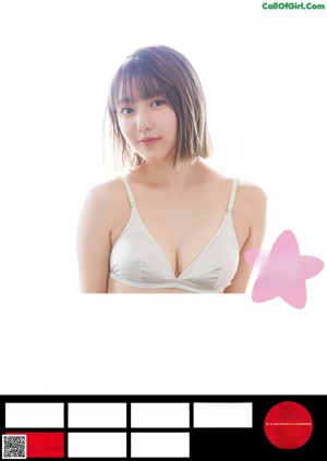 A woman in a white bra and panties posing for a magazine.