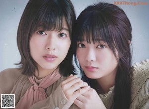 A couple of young women standing next to each other on a magazine cover.