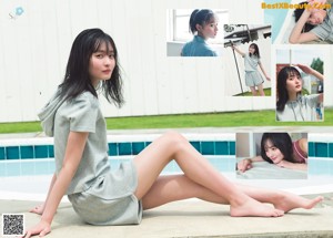 A woman in a denim shirt is posing for a magazine.