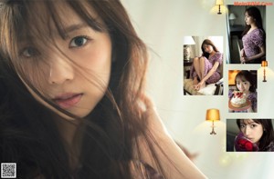 A woman in a white hoodie sitting on a bed.