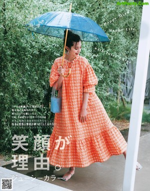 A woman sitting on a swing holding a bouquet of flowers.