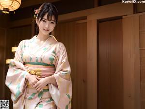 A woman in a blue and yellow kimono posing for a picture.